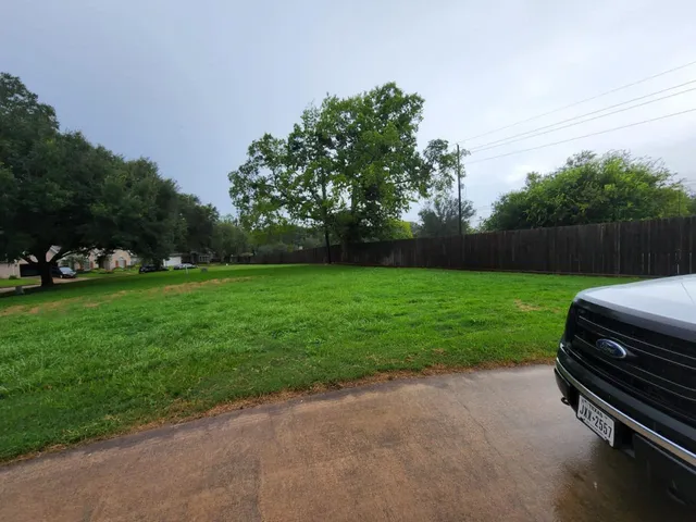 a backyard of a house with lots of green space