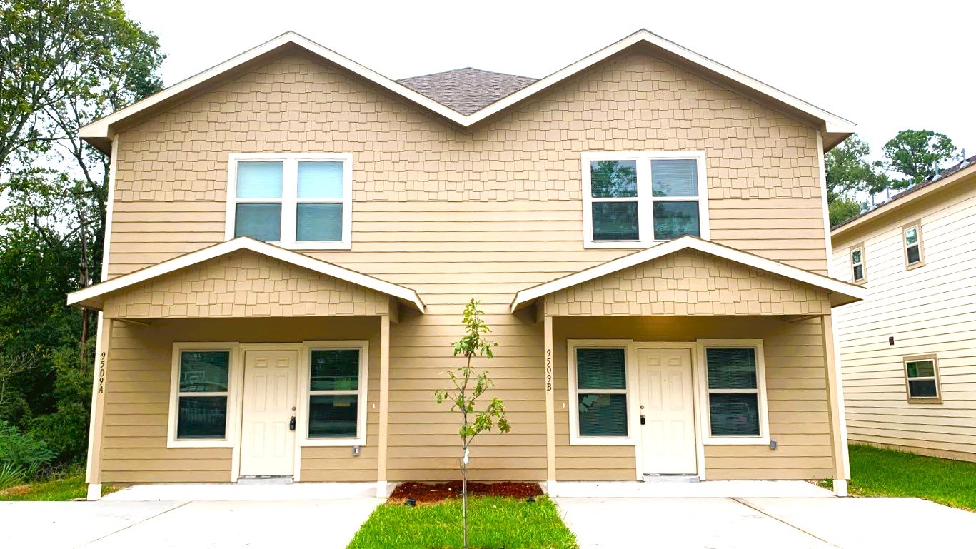 front view of a house and a yard