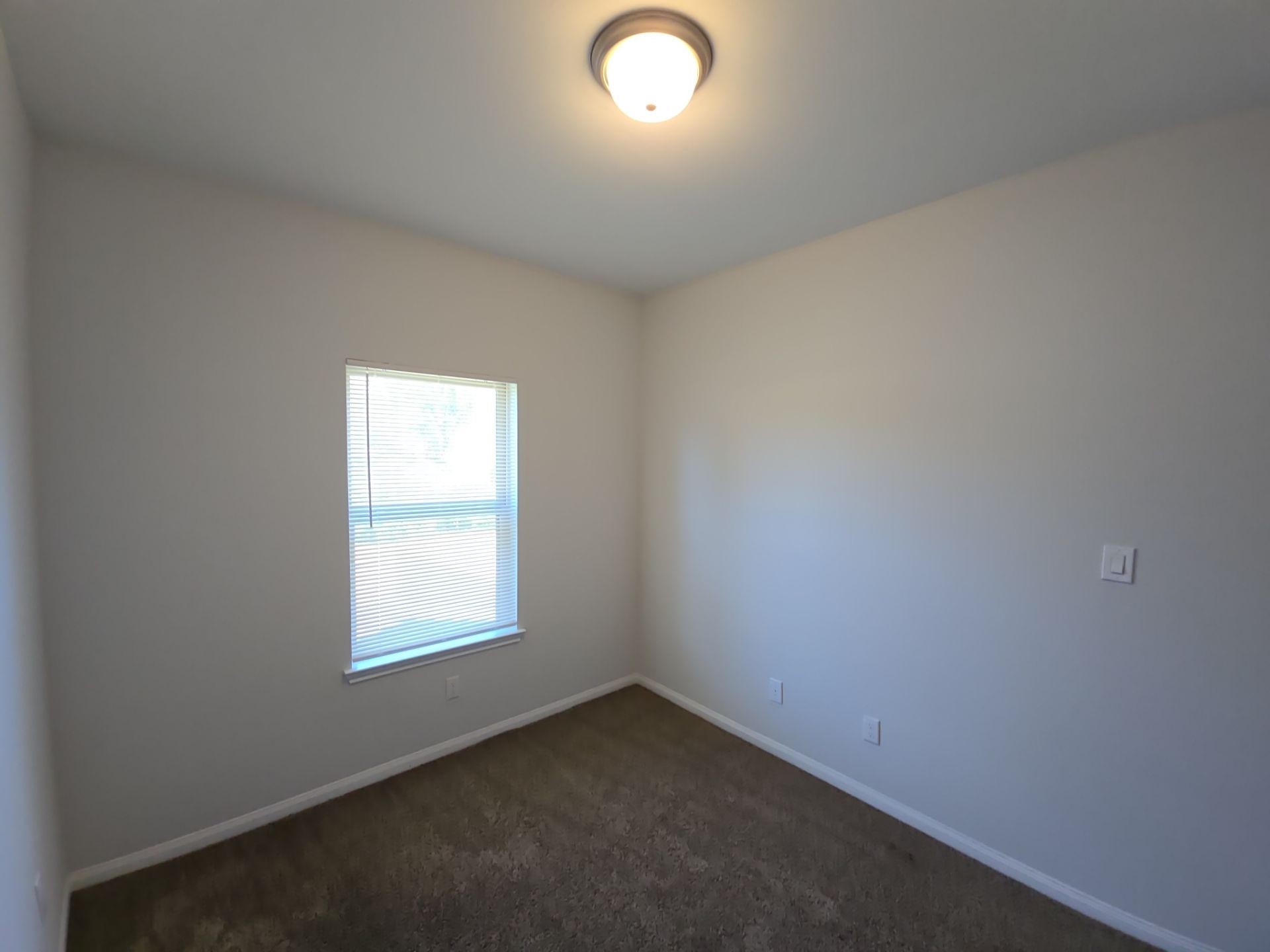 9509 Madera Road, Unit A Houston, TX 77078 - Photo 12 of 29 an empty room with a window