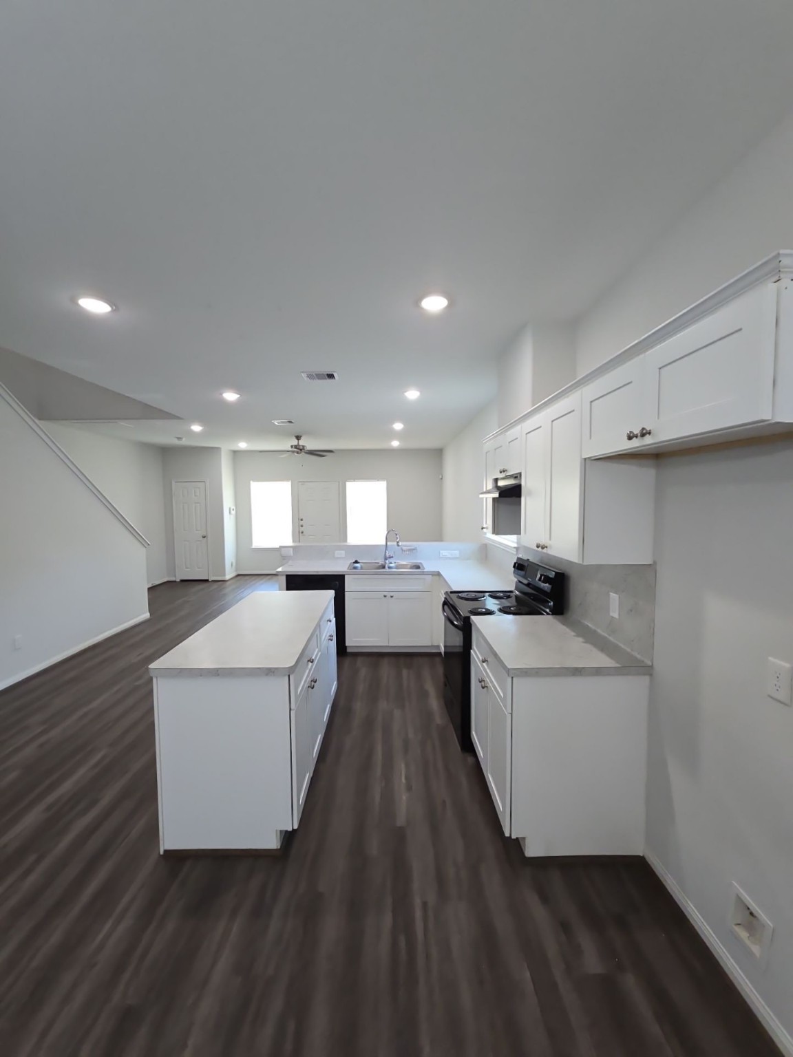 9509 Madera Road, Unit A Houston, TX 77078 - Photo 20 of 29 a large white kitchen with a white stove top oven and white cabinets