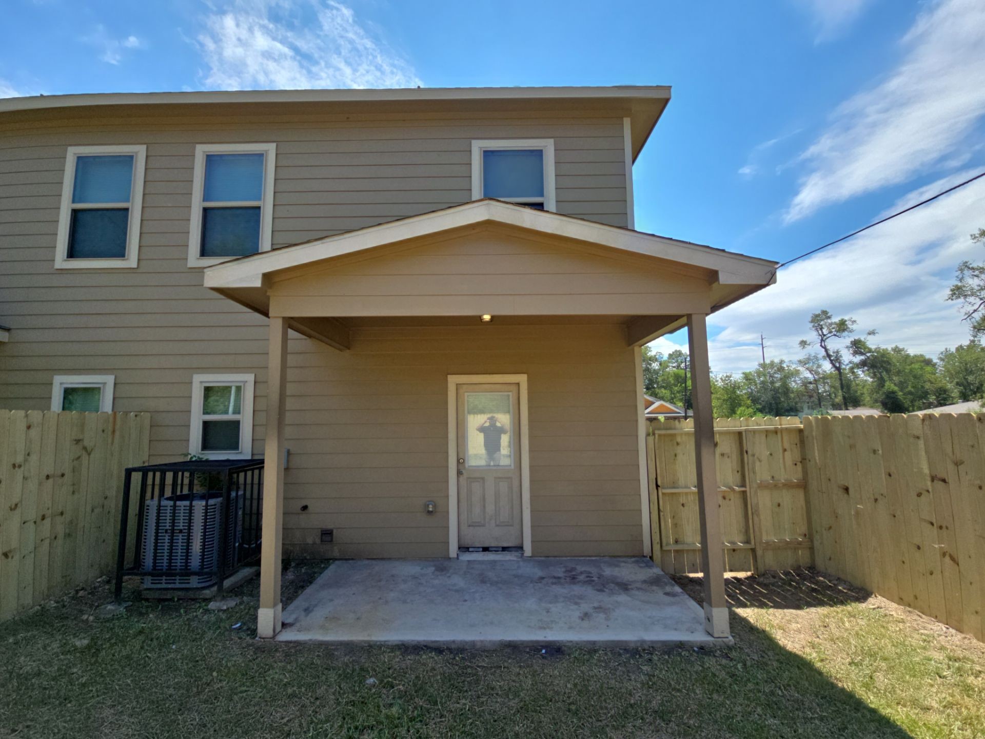 9509 Madera Road, Unit A Houston, TX 77078 - Photo 25 of 29 a front view of a house with a yard