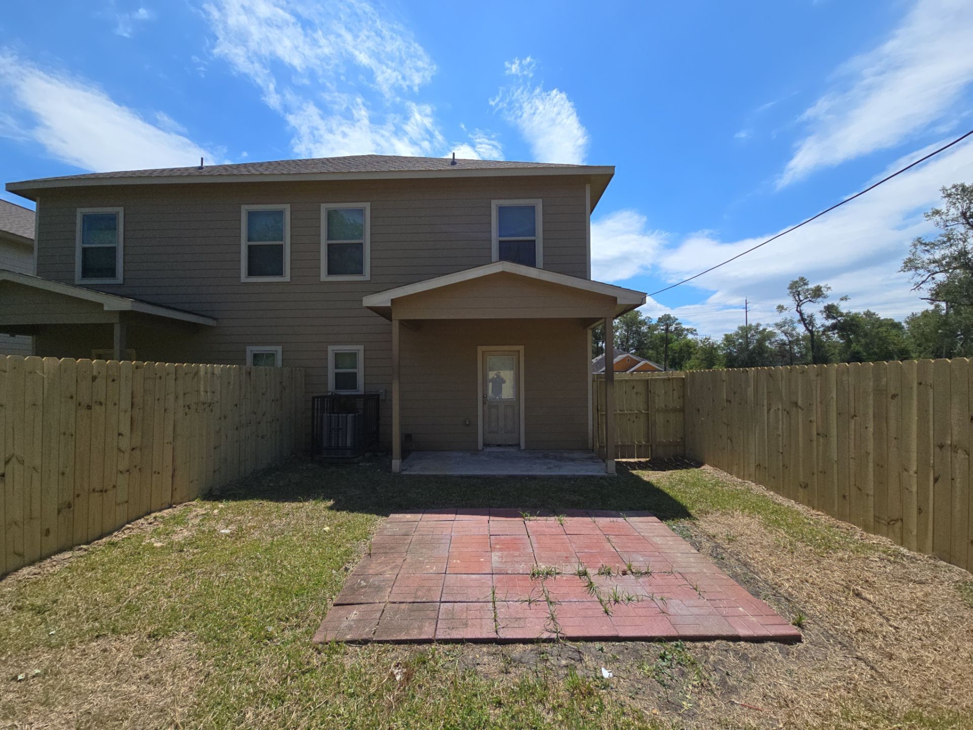 9509 Madera Road, Unit A Houston, TX 77078 - Photo 26 of 29 a front view of a house with a yard