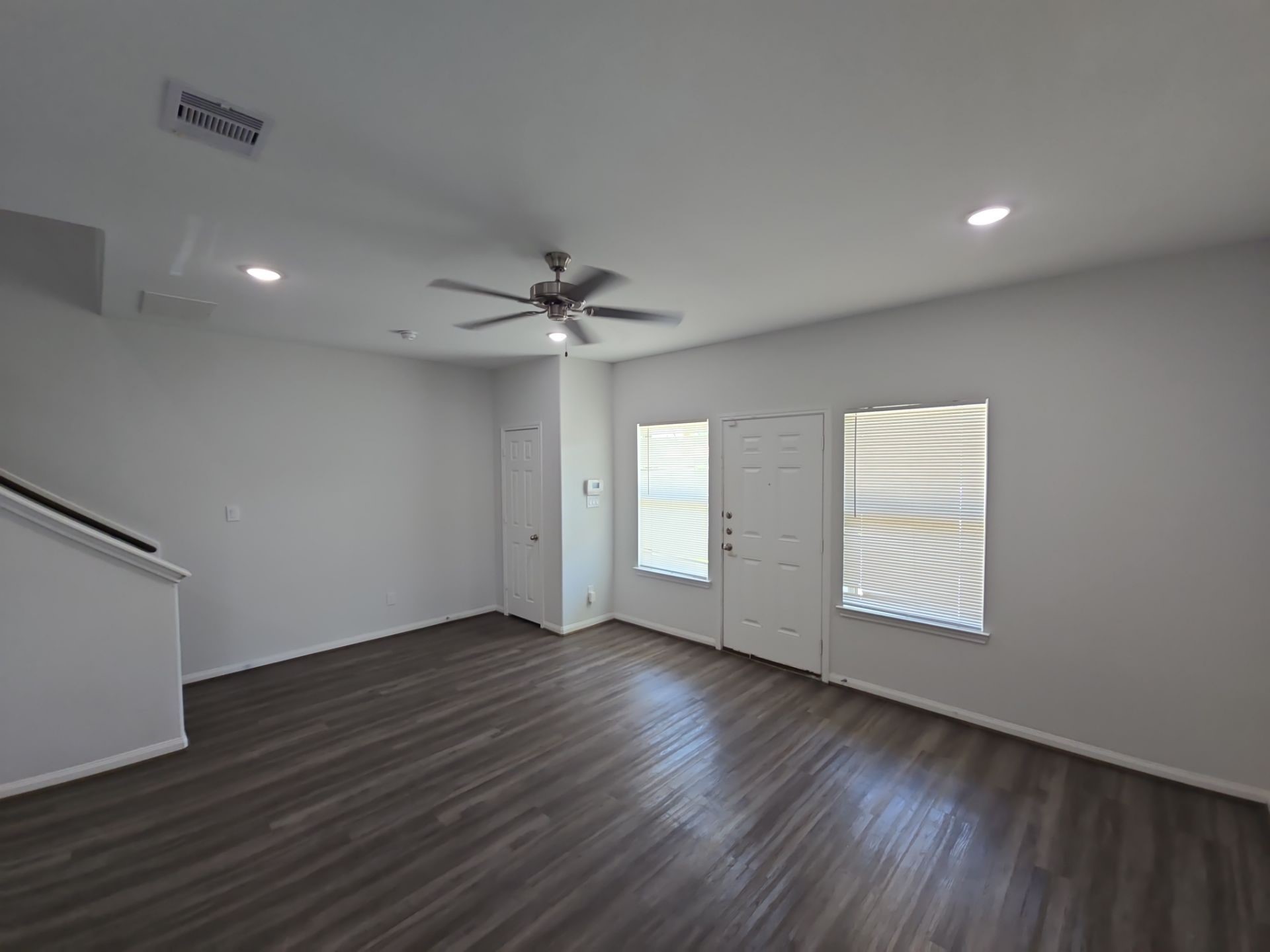 9509 Madera Road, Unit A Houston, TX 77078 - Photo 3 of 29 a view of an empty room with wooden floor and a window