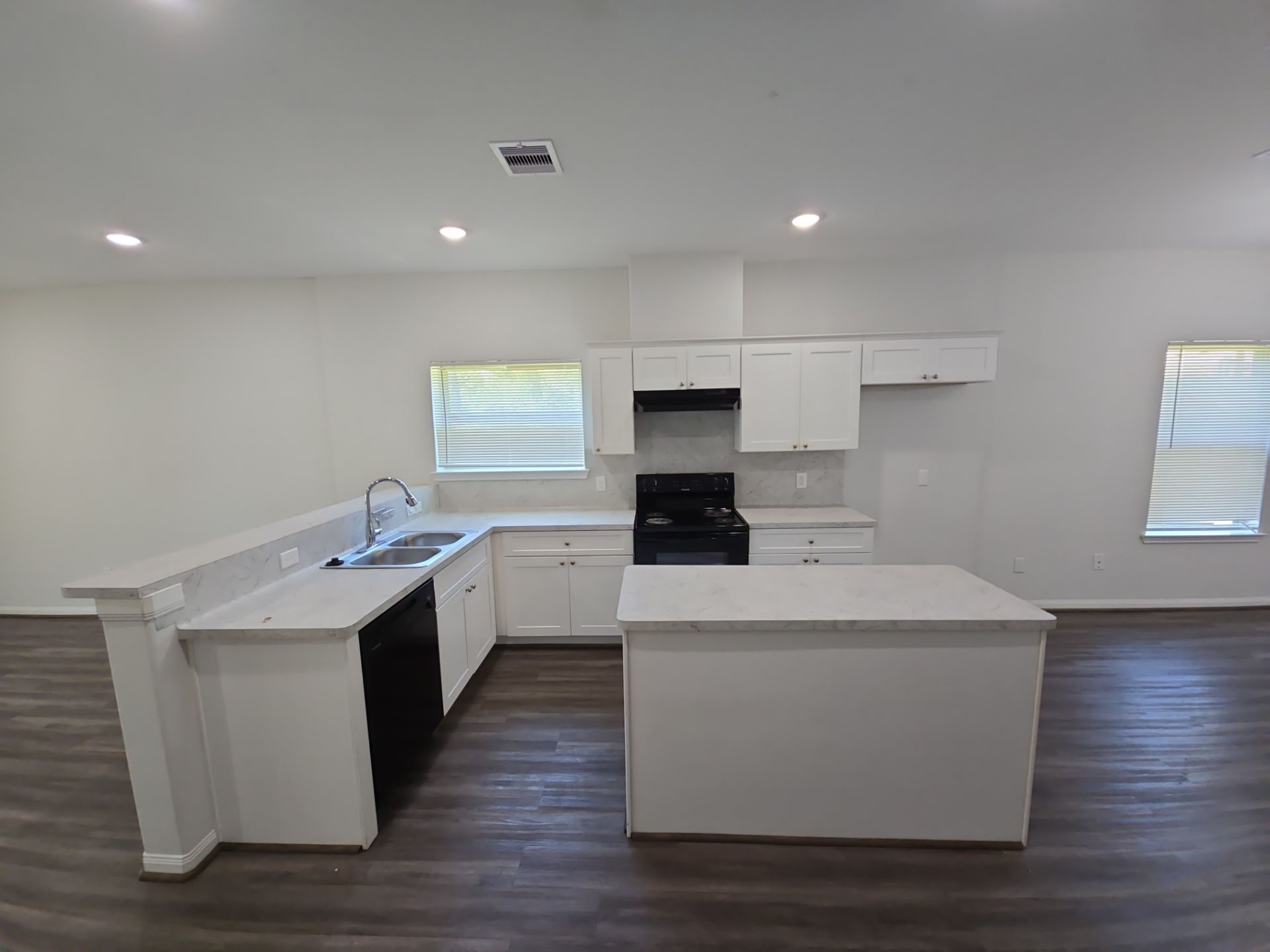 9509 Madera Road, Unit A Houston, TX 77078 - Photo 5 of 29 a kitchen with stainless steel appliances a white stove top oven sink and cabinets