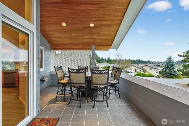 a view of a balcony with wooden floor