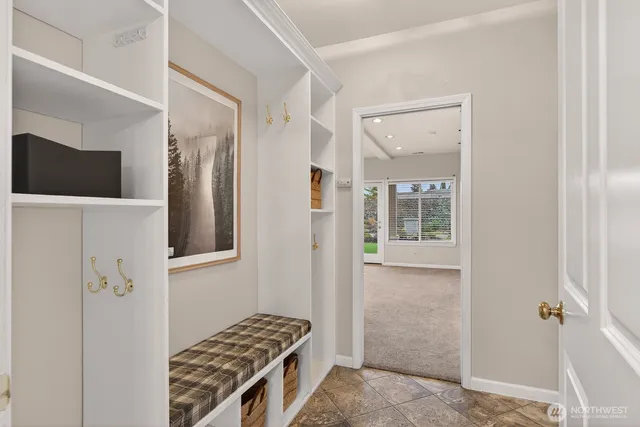 a view of an empty room with storage and utility