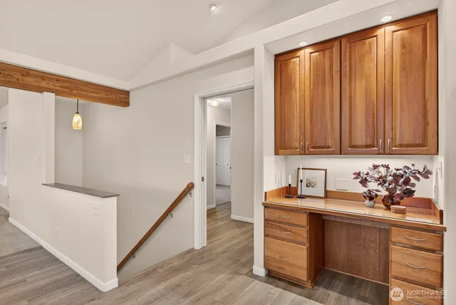 a view of a dining room with furniture large windows and wooden floor