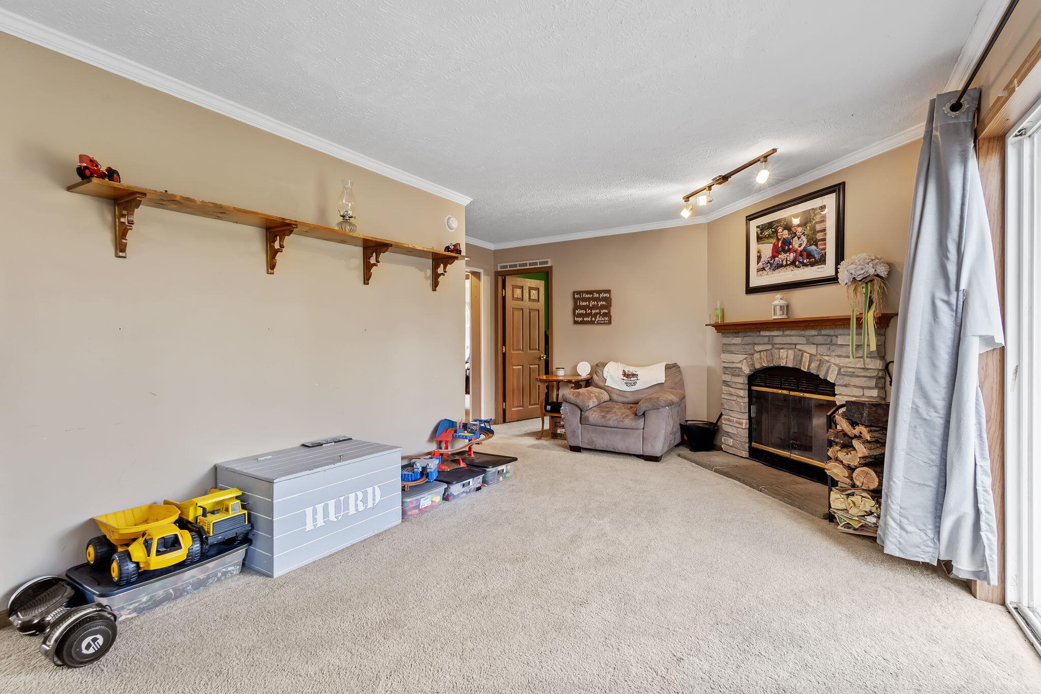 6303 Highway 231 Rensselaer, IN 47978 - Photo 11 of 41 a bedroom with furniture and a fireplace