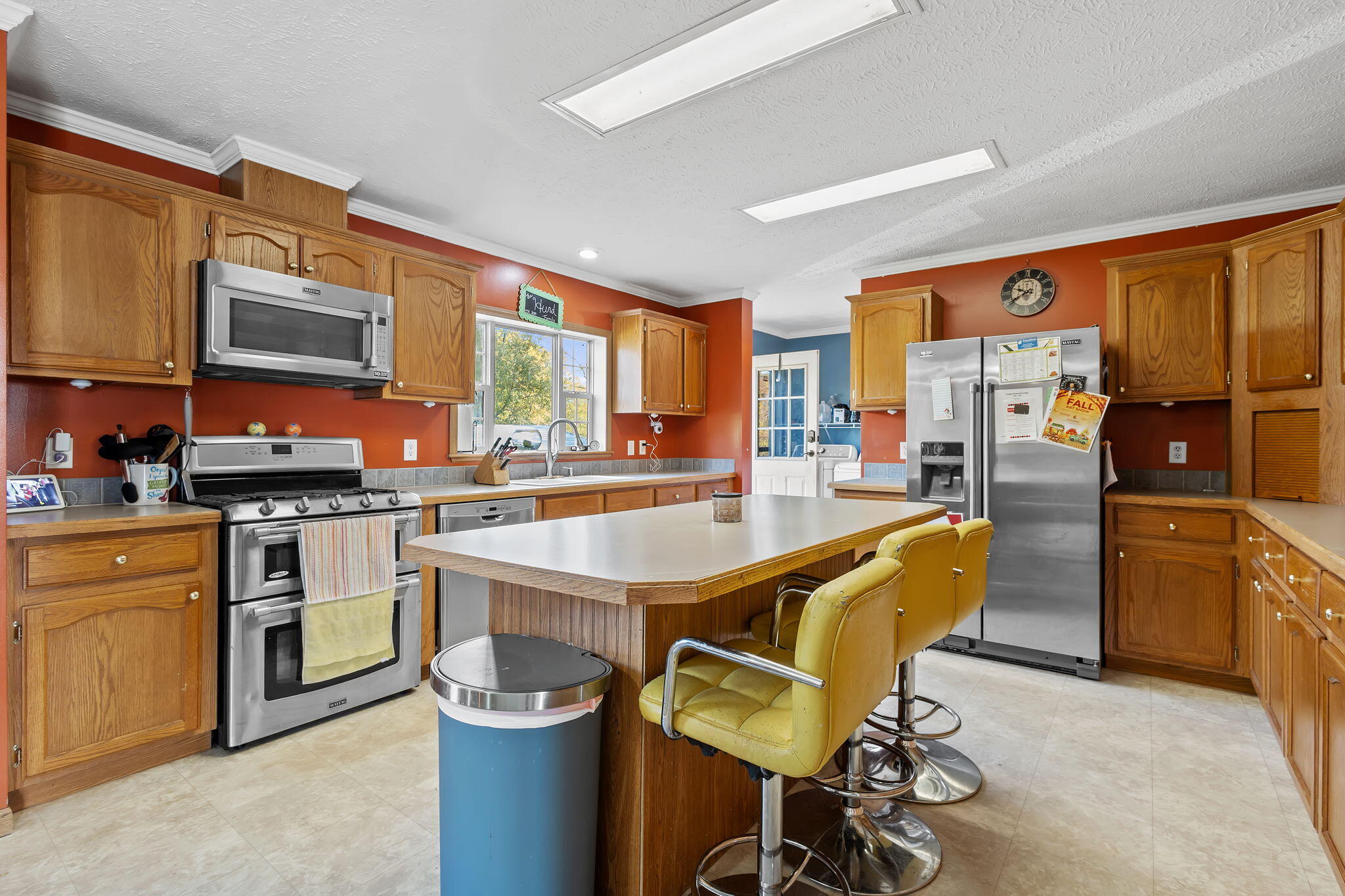 6303 Highway 231 Rensselaer, IN 47978 - Photo 17 of 41 a kitchen with a stove a sink and a refrigerator