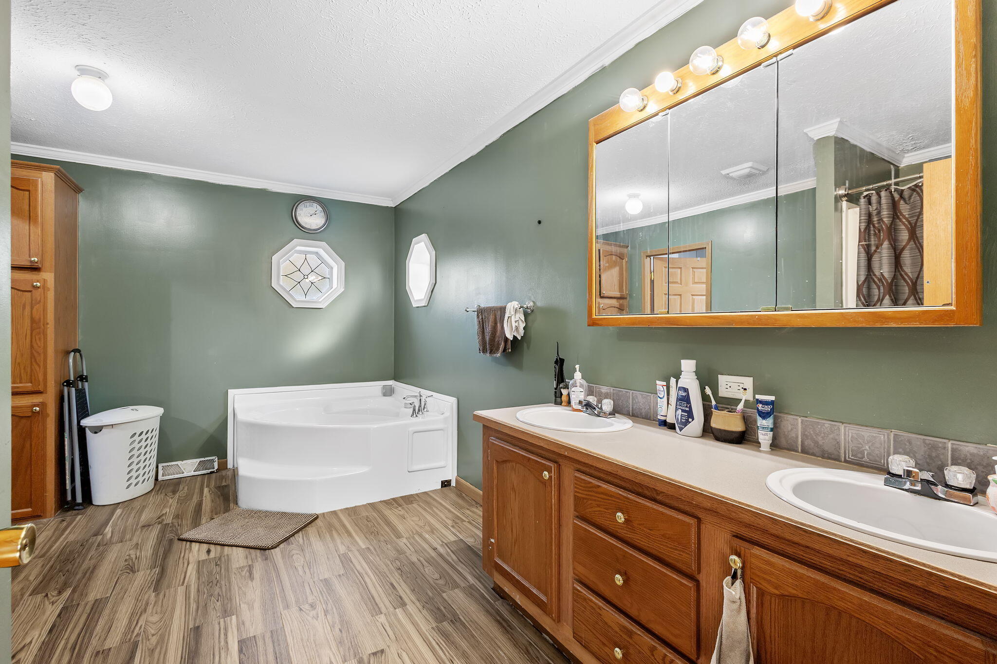 6303 Highway 231 Rensselaer, IN 47978 - Photo 28 of 41 a spacious bathroom with a double vanity sink and a mirror