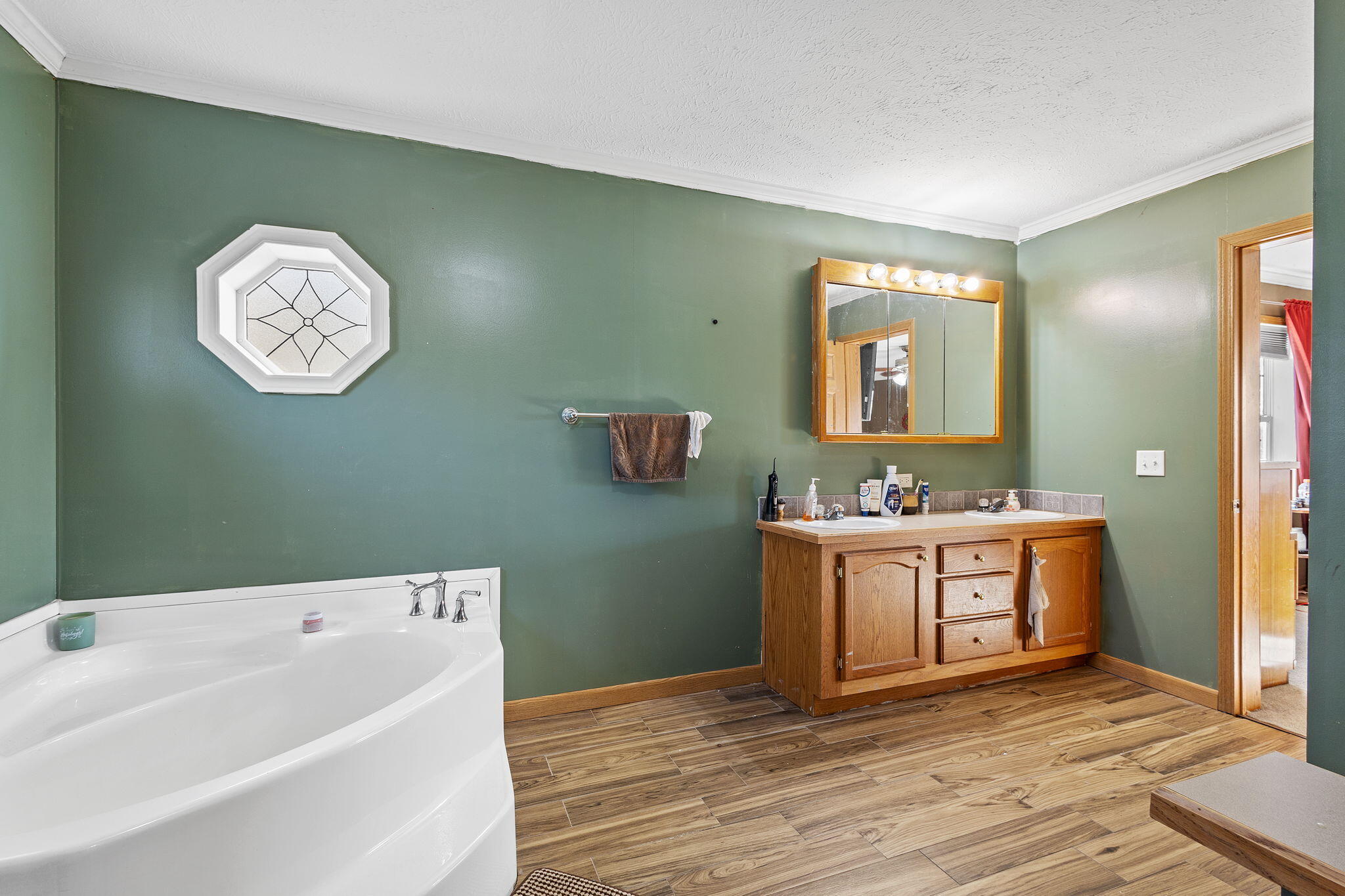 6303 Highway 231 Rensselaer, IN 47978 - Photo 29 of 41 a spacious bathroom with a tub sink and mirror