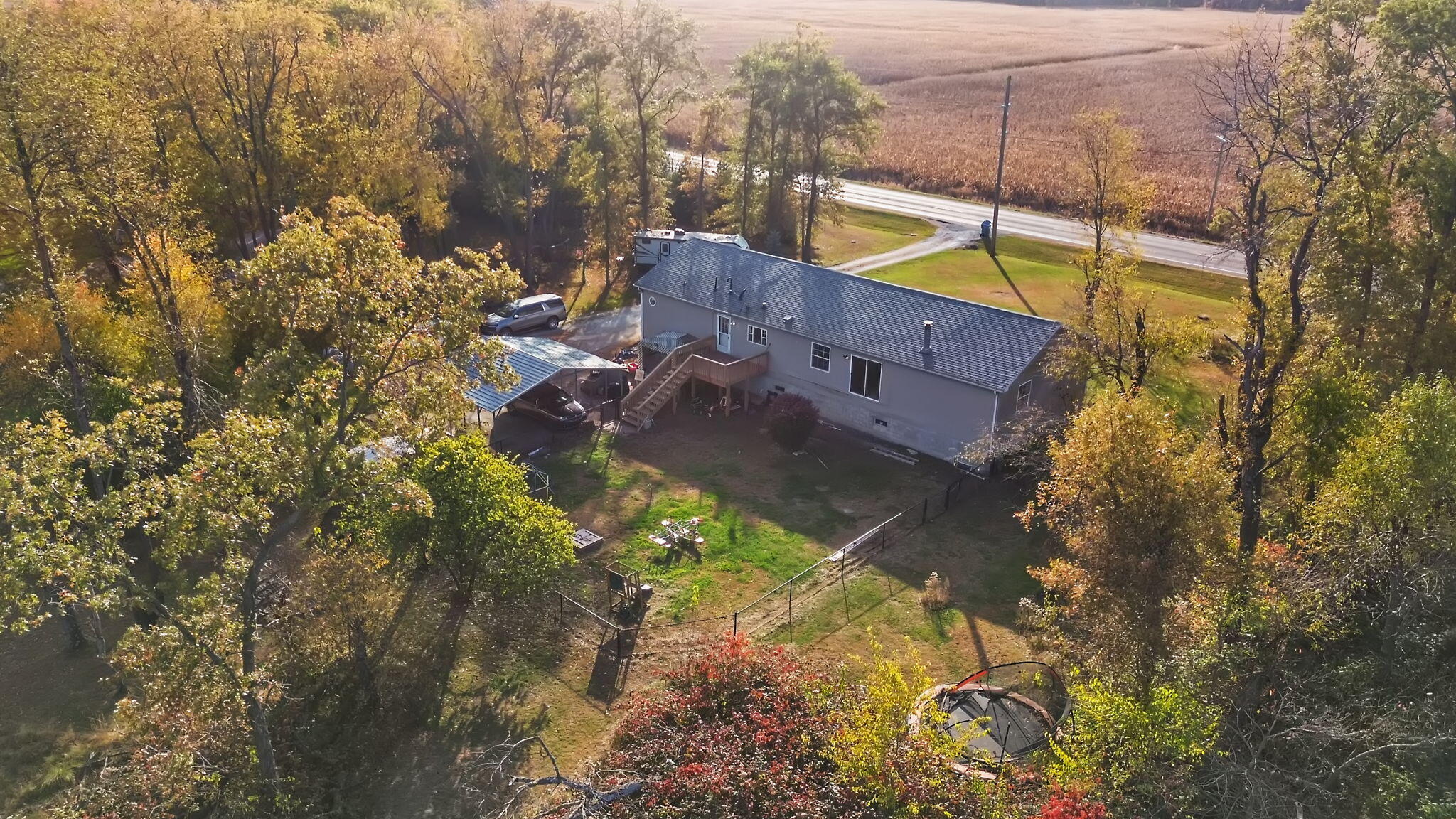6303 Highway 231 Rensselaer, IN 47978 - Photo 3 of 41 a view of a house with a yard and a large park
