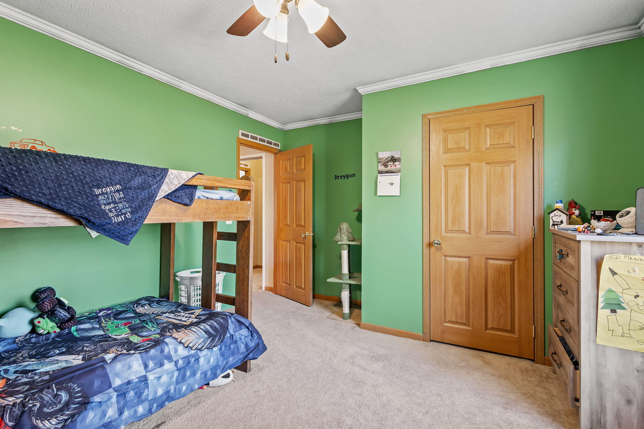 6303 Highway 231 Rensselaer, IN 47978 - Photo 34 of 41 a spacious bedroom with a bed and a chandelier