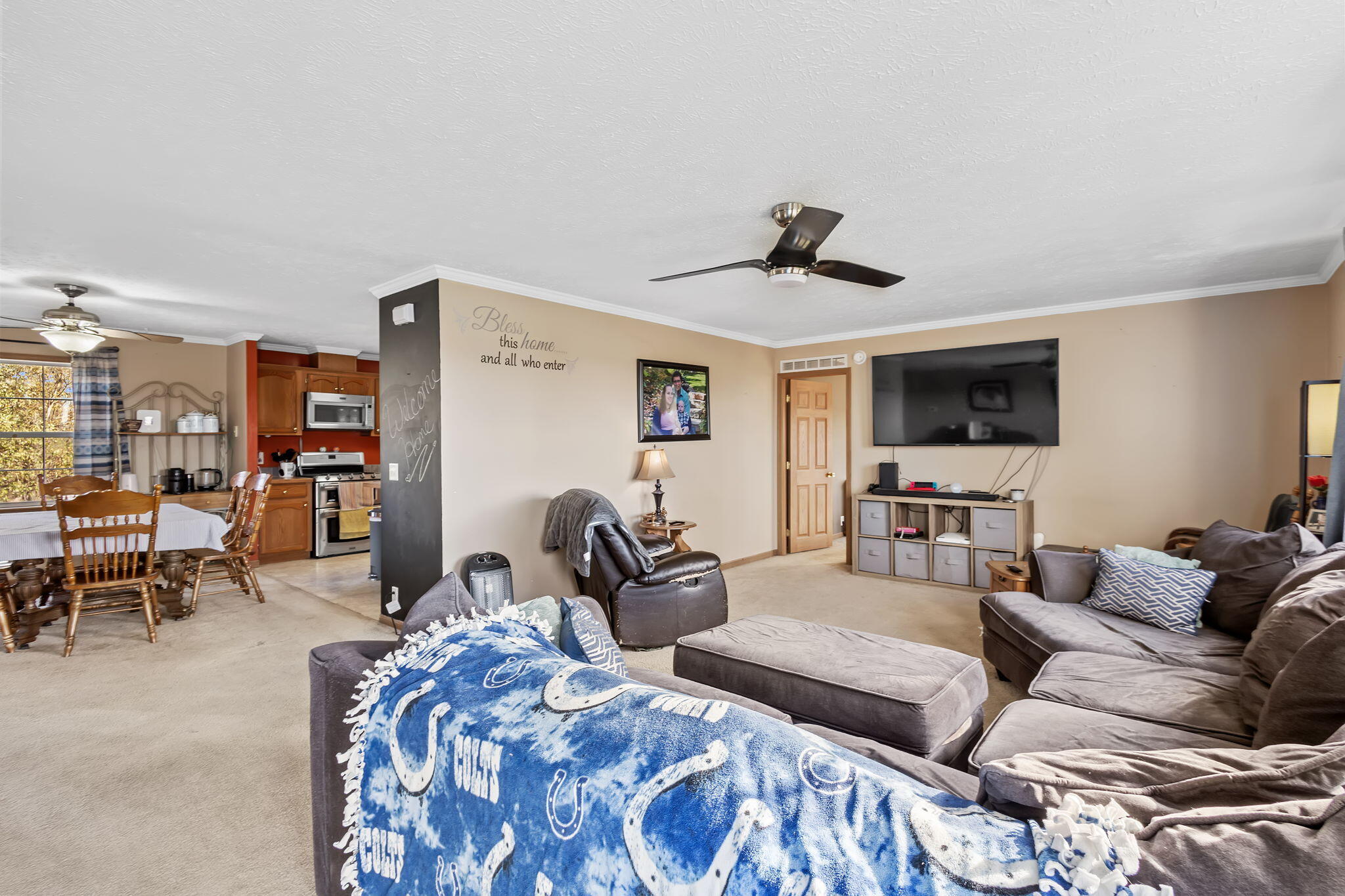 6303 Highway 231 Rensselaer, IN 47978 - Photo 6 of 41 a living room with furniture and a flat screen tv