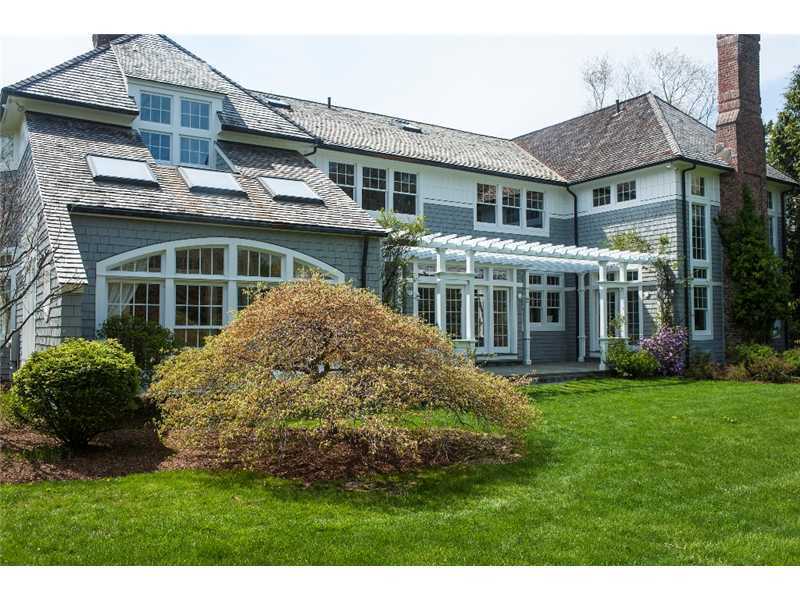 1021 Ponus Ridge Road New Canaan, CT 06840 - Photo 22 of 25 a front view of a house with a garden