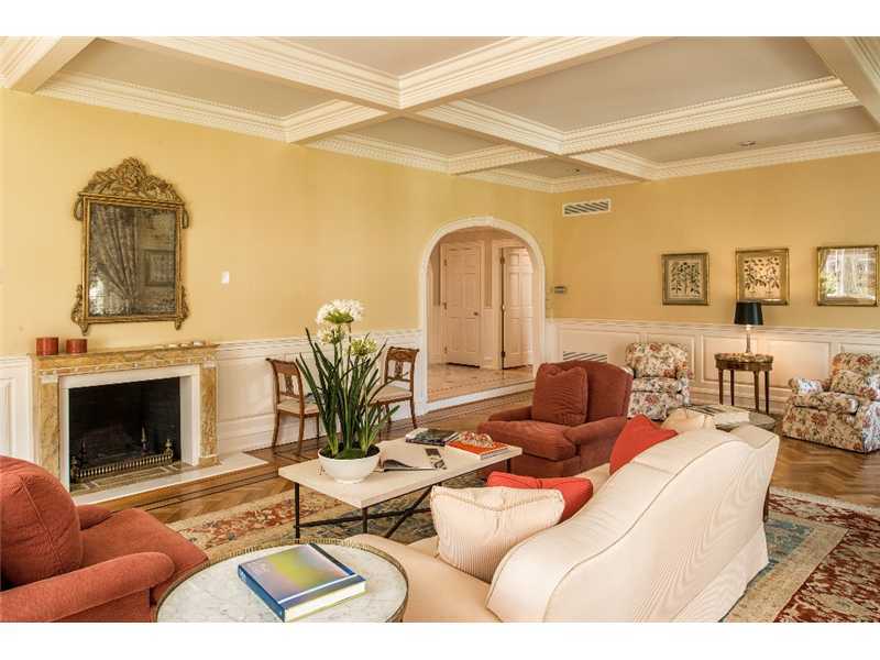 1021 Ponus Ridge Road New Canaan, CT 06840 - Photo 3 of 25 a living room with furniture a fireplace and a flat screen tv