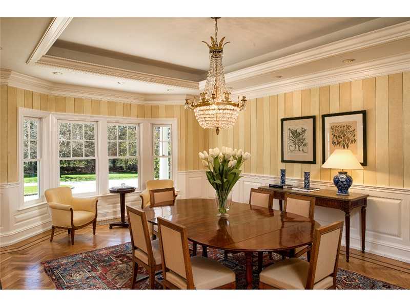 1021 Ponus Ridge Road New Canaan, CT 06840 - Photo 5 of 25 a view of a dining room with furniture and a chandelier