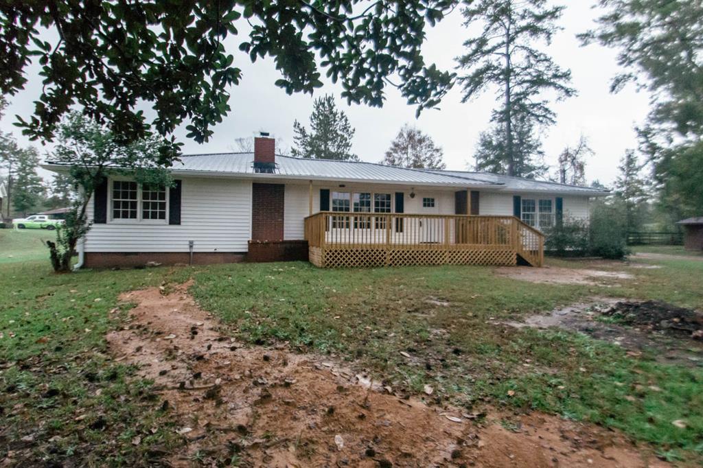 4841 Sandy Point Road Lizella, GA 31052 - Photo 1 of 42 a view of a house with yard and a garden