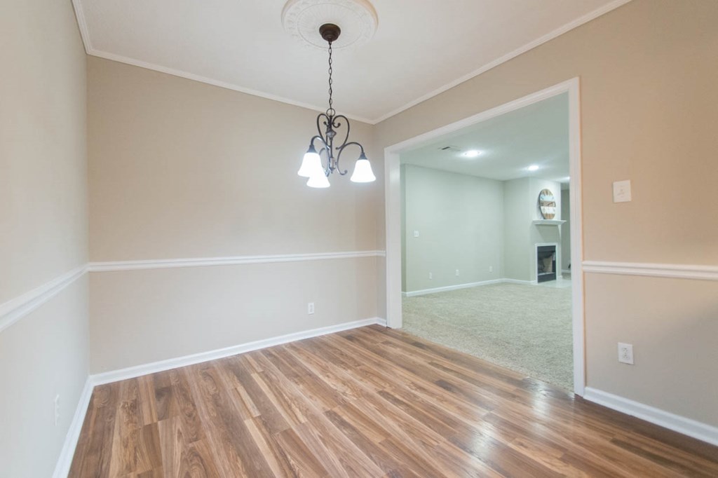 4841 Sandy Point Road Lizella, GA 31052 - Photo 11 of 42 a view of empty room with wooden floor and fan