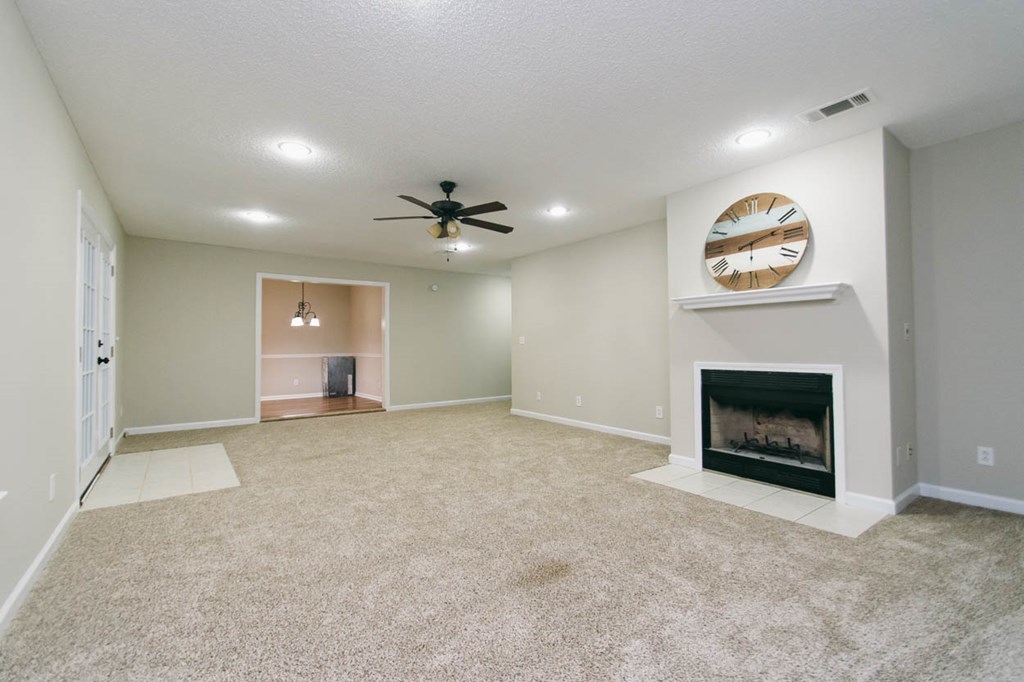 4841 Sandy Point Road Lizella, GA 31052 - Photo 23 of 42 an empty room with windows and fireplace