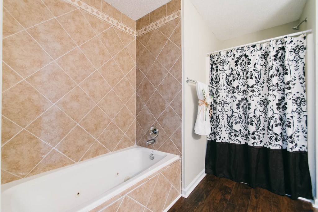 4841 Sandy Point Road Lizella, GA 31052 - Photo 27 of 42 a bathroom with a bathtub and shower