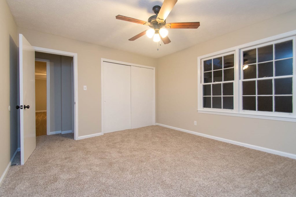 4841 Sandy Point Road Lizella, GA 31052 - Photo 36 of 42 a view of empty room with windows and ceiling fan