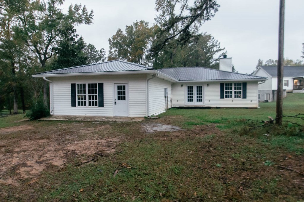 4841 Sandy Point Road Lizella, GA 31052 - Photo 39 of 42 a house with trees in the background