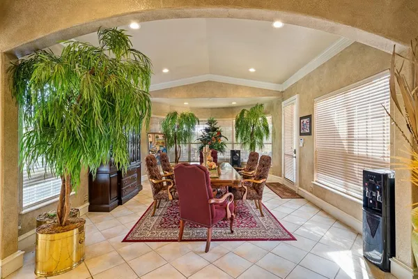 a view of a dining room with furniture window and outside view