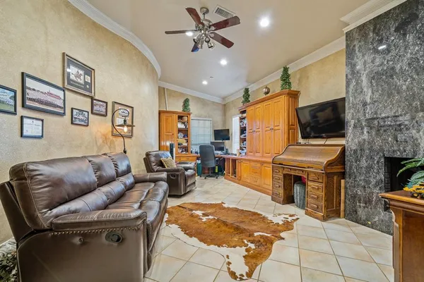a view of a livingroom with furniture and a window