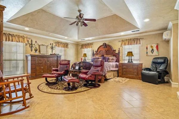 a bathroom with a tub a double vanity sink and a large mirror