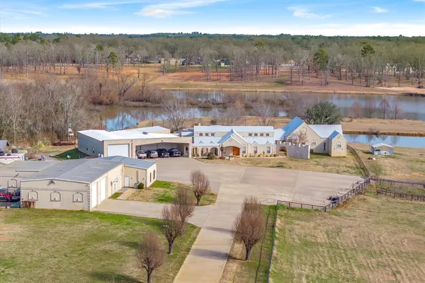 a view of a lake with green field