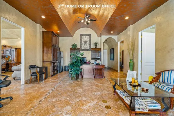 a living room with lots of furniture and a chandelier