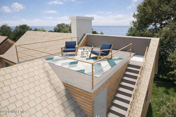 a view of a terrace with furniture and garden