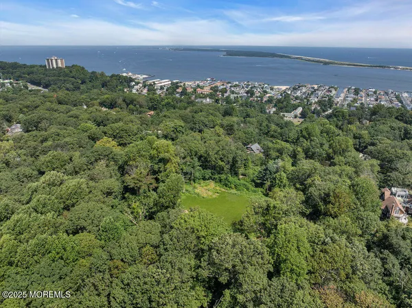 an aerial view of a houses with a yard