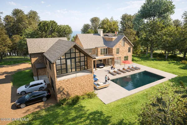 a view of a house with backyard porch and garden