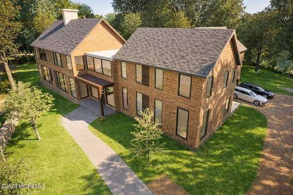 aerial view of a house with a yard