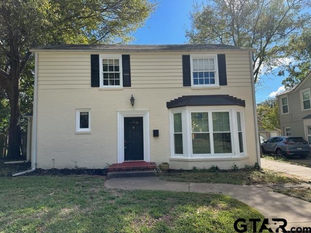 2002 South Robertson Avenue Tyler, TX 75701 - Photo 1 of 16 a house with trees in the background