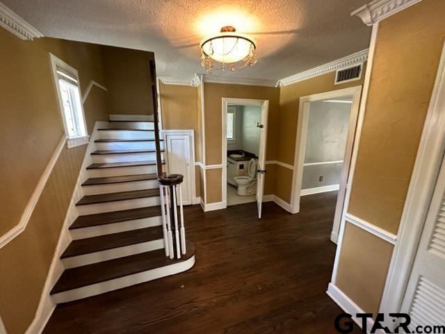 2002 South Robertson Avenue Tyler, TX 75701 - Photo 2 of 16 a view of a hallway with wooden floor and stairs