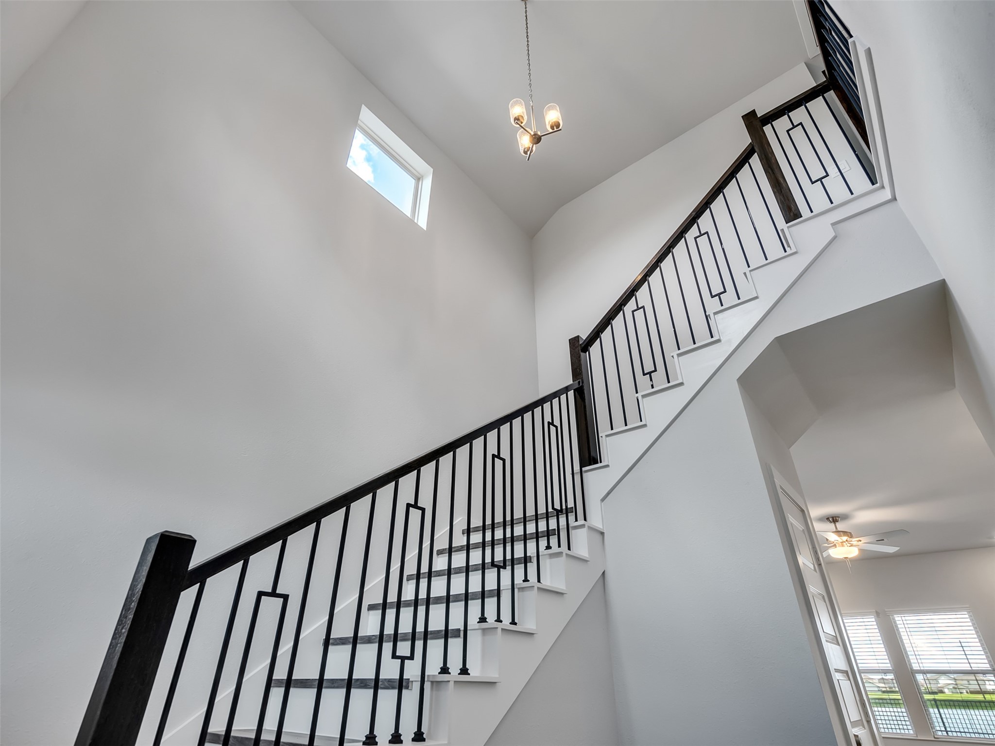 1206 Elsinore Drive Rosharon, TX 77583 - Photo 10 of 21 a view of staircase with wooden floor and fan