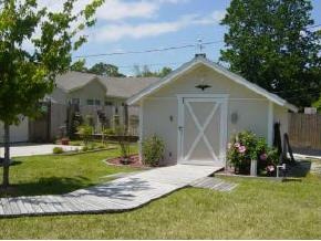 701 Northwest Rostock Palm Bay, FL 32907 - Photo 2 of 8 a front view of a house with garden