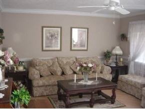 701 Northwest Rostock Palm Bay, FL 32907 - Photo 4 of 8 a living room with furniture and flowers