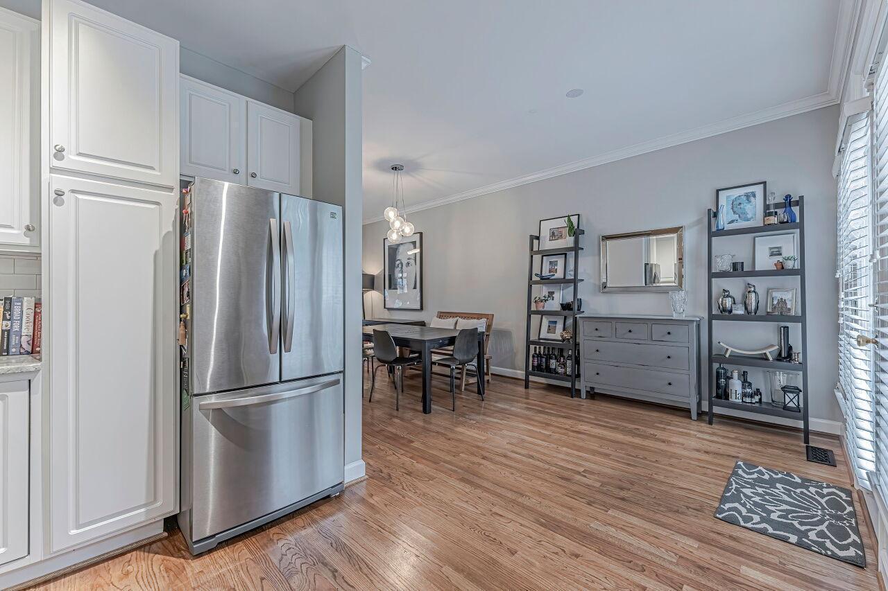106 Hatfield Lane Raleigh, NC 27603 - Photo 12 of 29 a kitchen with stainless steel appliances granite countertop a refrigerator and a stove top oven