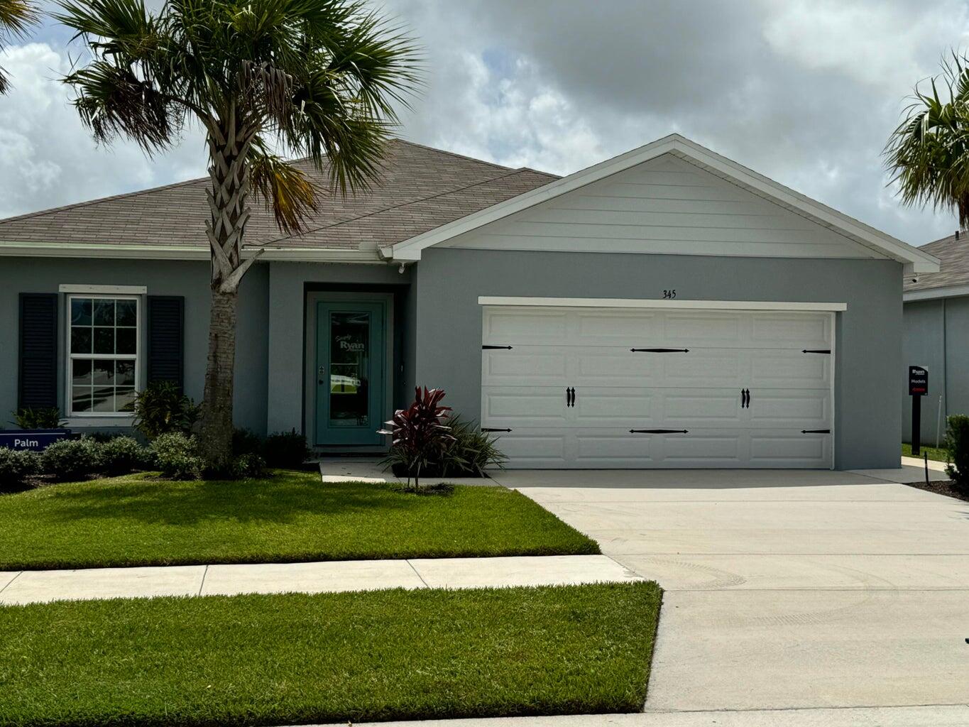 345 Clementine Road Fort Pierce, FL 34981 - Photo 13 of 13 a front view of a house with a yard