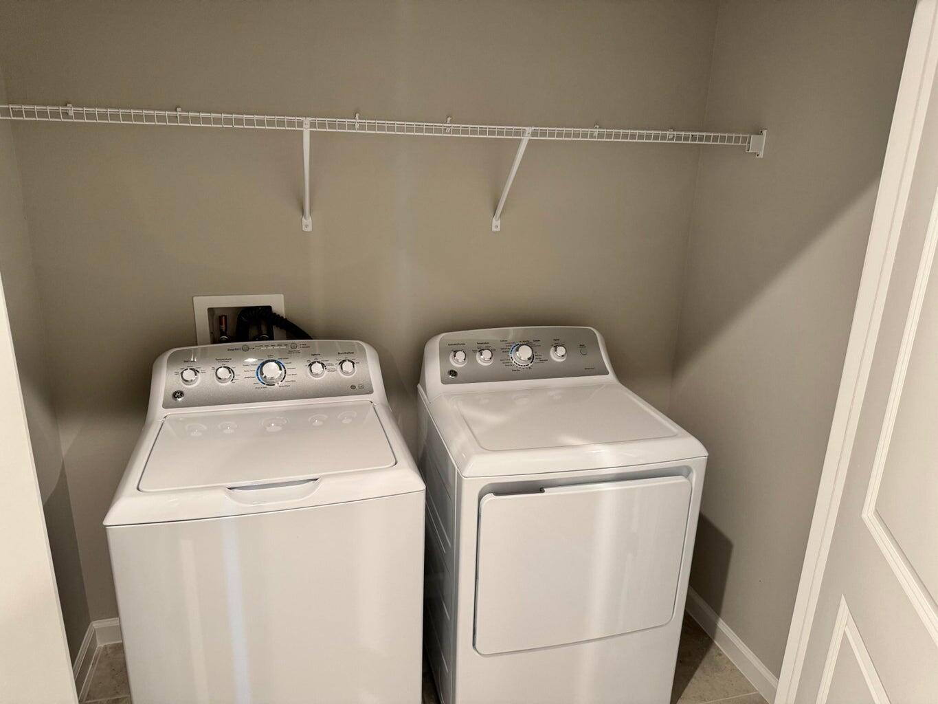 345 Clementine Road Fort Pierce, FL 34981 - Photo 5 of 13 a utility room with dryer and washer