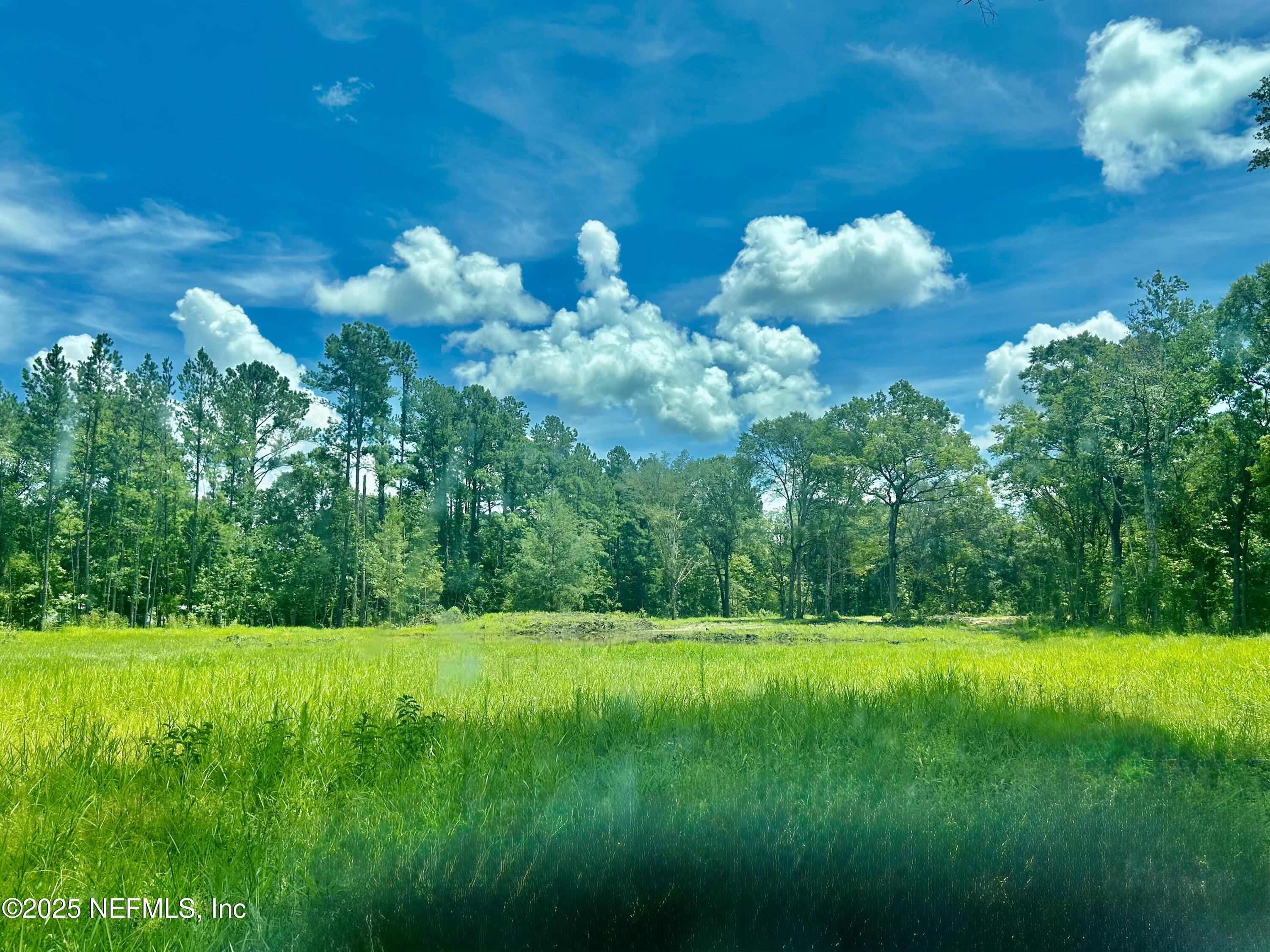 0 Wilbur Jones Road Callahan, FL 32011 - Photo 27 of 31 a view of a white house with a yard