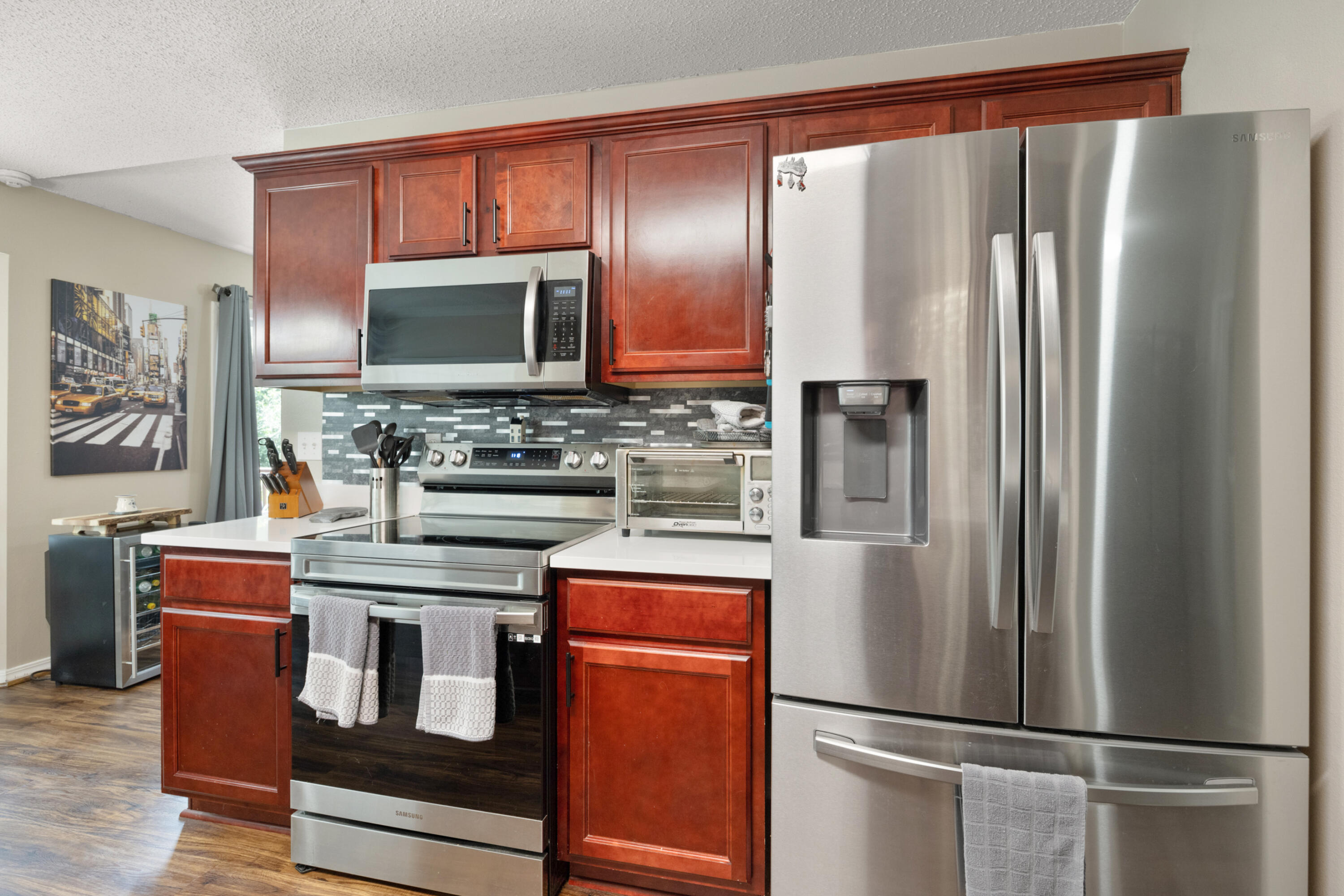 143 Sandstone Trail Crestview, FL 32539 - Photo 12 of 40 a kitchen with stainless steel appliances granite countertop a refrigerator and a stove top oven