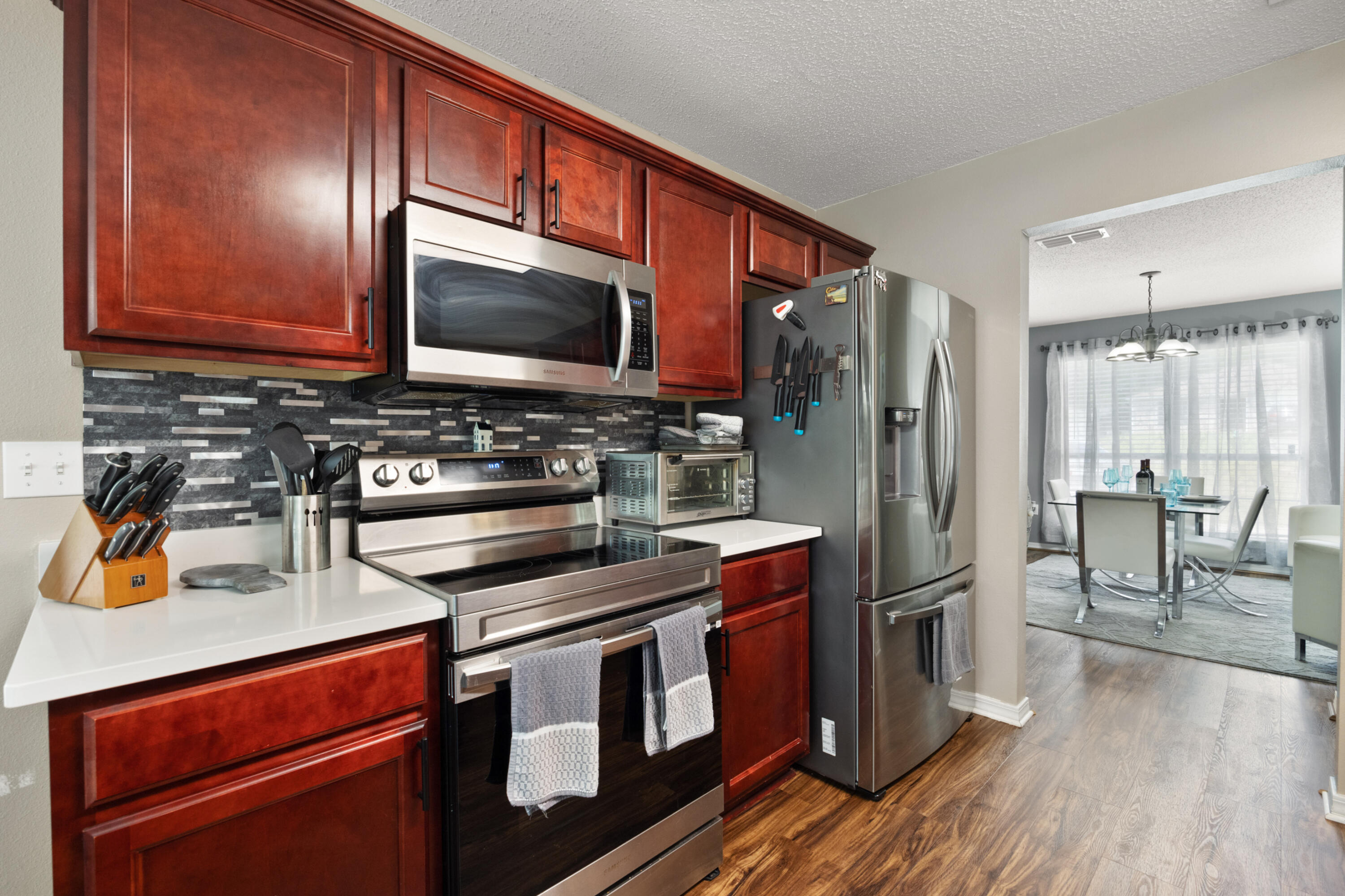 143 Sandstone Trail Crestview, FL 32539 - Photo 13 of 40 a kitchen with stainless steel appliances granite countertop a refrigerator stove and sink
