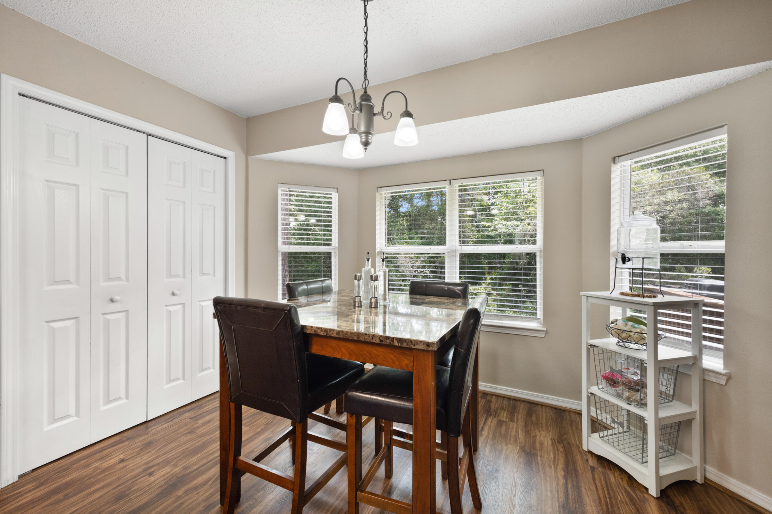 143 Sandstone Trail Crestview, FL 32539 - Photo 15 of 40 a view of a dining room with furniture window and wooden floor