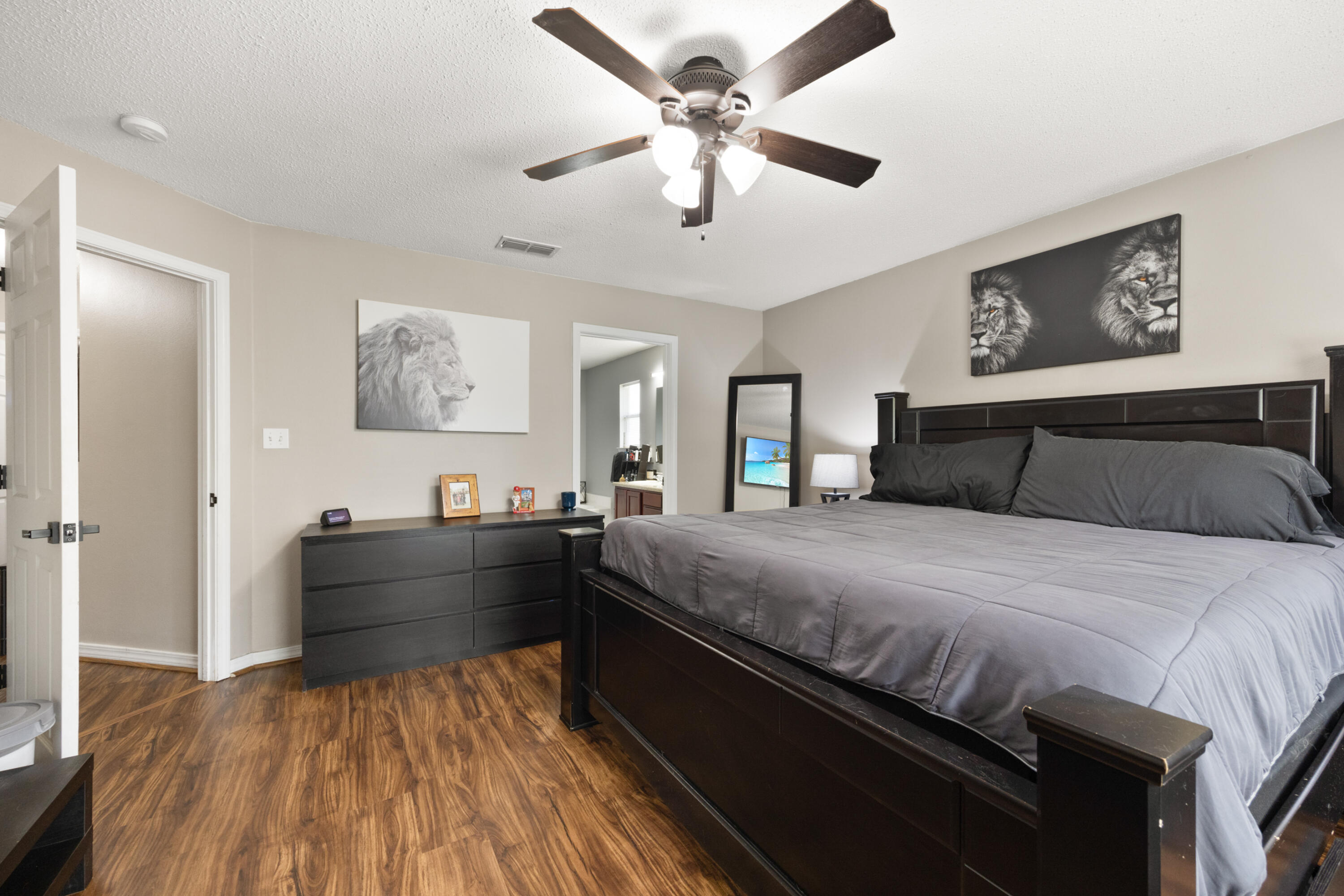 143 Sandstone Trail Crestview, FL 32539 - Photo 20 of 40 a bed room with a bed and a chandelier