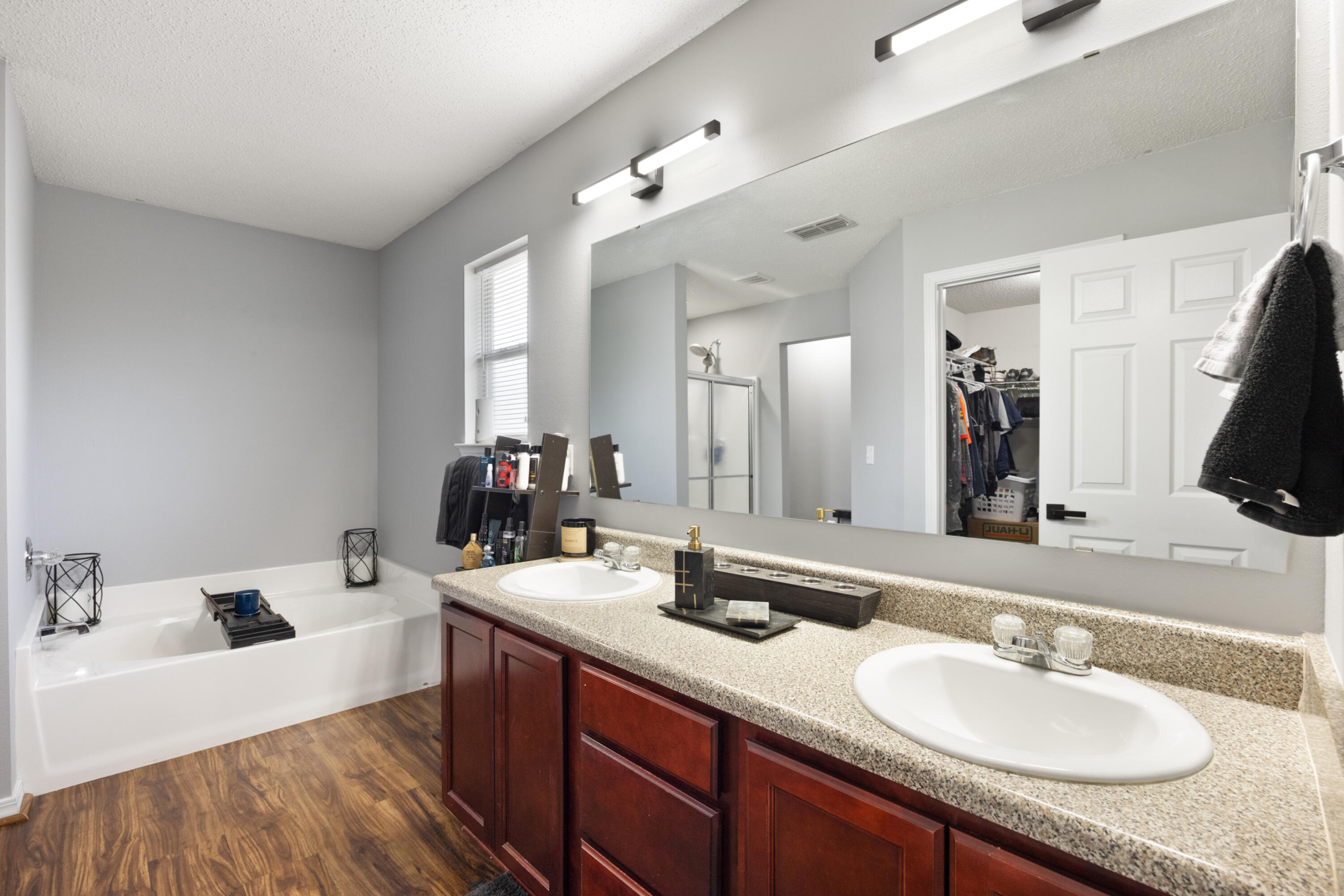 143 Sandstone Trail Crestview, FL 32539 - Photo 21 of 40 a en suite bathroom with a sink double vanity granite and a large mirror